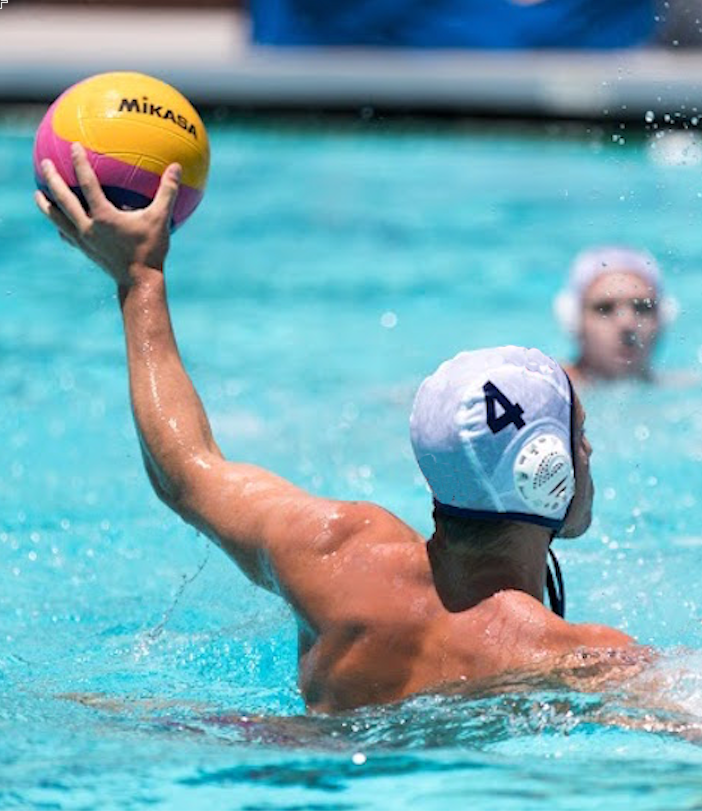 A player rising out of the water with a ball